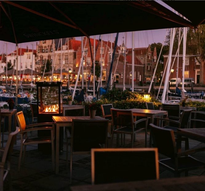 Patio heaters lighting a restaurant patio at night